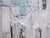This oil on board artwork captures the essence of Ostuni, Italy, through a textured interplay of soft whites and muted...