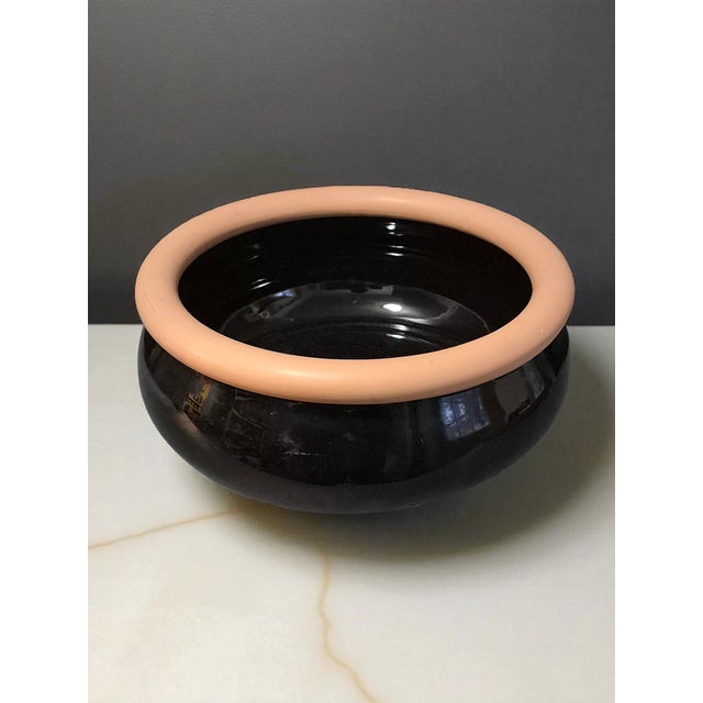 This Vintage Mid-Century Modern Black Glazed Terra-Cotta Bowl is a handmade piece of art pottery from Portugal. The round...