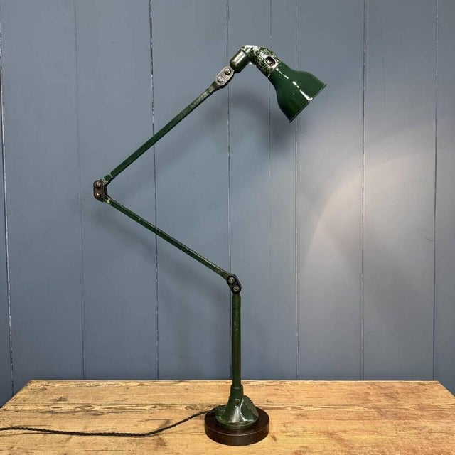Stunning dark green three-arm Mek Elek table or floor lamp with a dark green enamel shade. This lamp originates from...