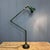 Stunning dark green three-arm Mek Elek table or floor lamp with a dark green enamel shade. This lamp originates from...