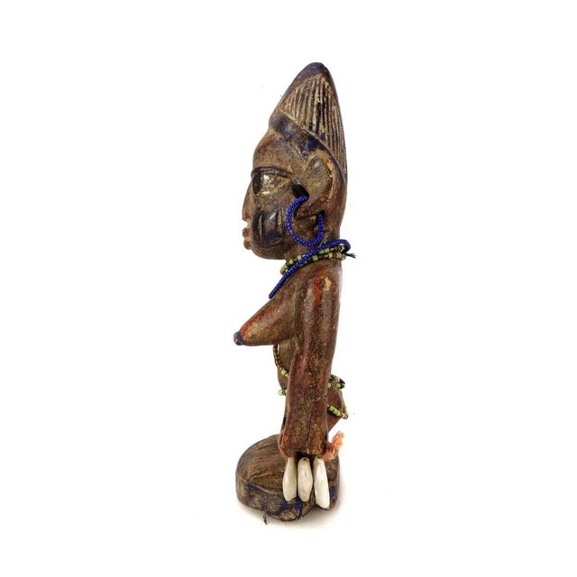 Ibeji figures, carved by the Yoruba people of Nigeria, are wooden twin sculptures holding cultural significance in Yoruba...