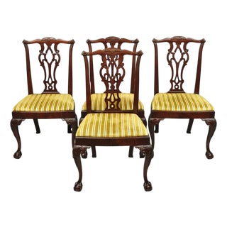 Early 20th Century John Stuart Chippendale Carved Mahogany Ball and Claw Dining Chairs - Set of 4 For Sale