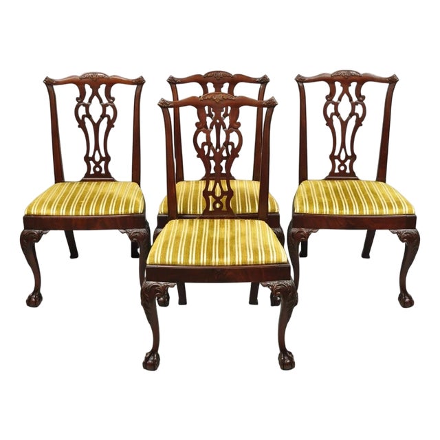 Early 20th Century John Stuart Chippendale Carved Mahogany Ball and Claw Dining Chairs - Set of 4 For Sale