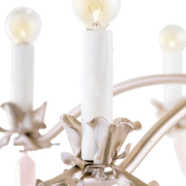 The Francie Chandelier adds a whimsical note to any design with slender leaves, flower petal bobeches and quartz crystal...