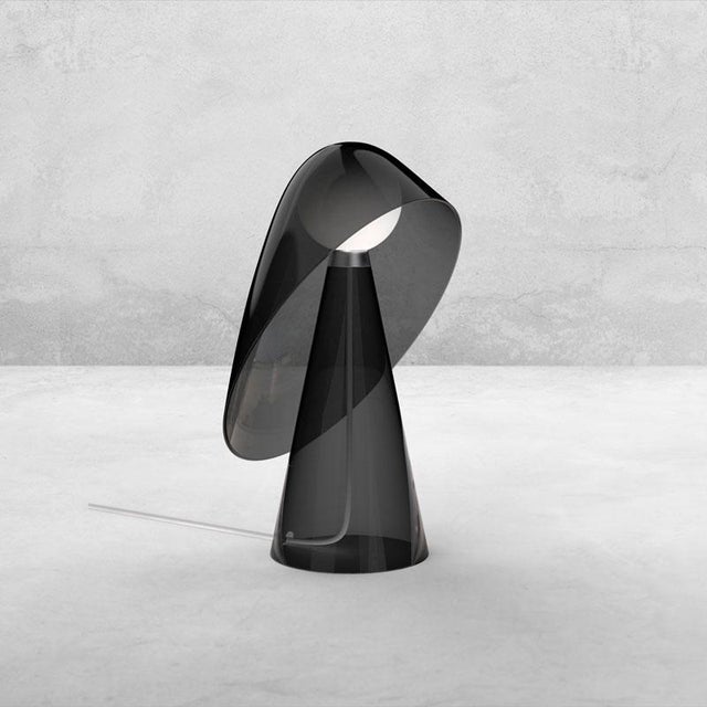 «Mademoiselle» is a crystalline lamp. The superposition of transparent elements sketches an evanescent silhouette. The...
