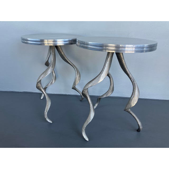 A lovely pair of aluminum gueridon side tables attributed to Arthur Court, circa 1970s. This is great pair of iconic...