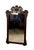 Large antique wall mirror featuring an elaborately hand-carved frame with exceptional decorative detailing. The mirror is...