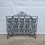 Wonderful cast iron frame accented with scrolls and grapevines graces the simplistic bi-fold design of this fireplace screen.