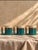 Charming set of three vintage 1980s Padilla ceramic mugs featuring a rich teal glaze, creamy neutral upper sections, and...