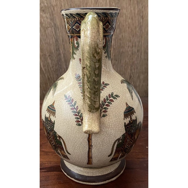Striking large jug-style vase by Three Hands Corp, measuring approximately 10½ inches tall. Features a beautifully...