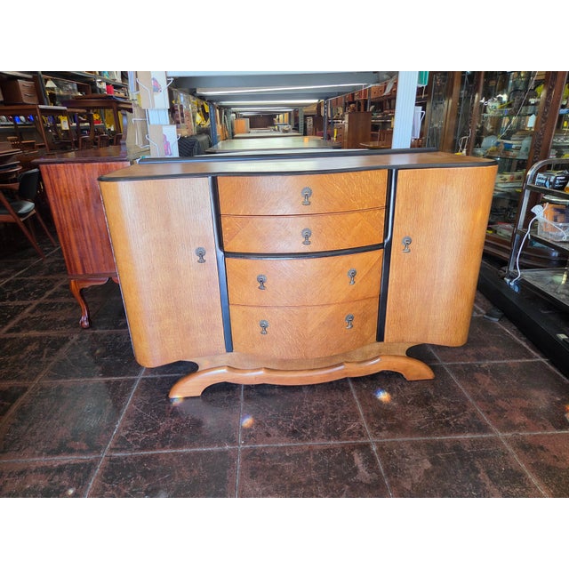 A nice Art Deco Sideboard from England. Oak wood and really cool. Great for cocktail bar, home office, study, kitchen,...
