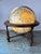 Retro Illuminated 12" Table Globe by Repogle, stands on a footed wooden base - ready to serve as your adventure planner....