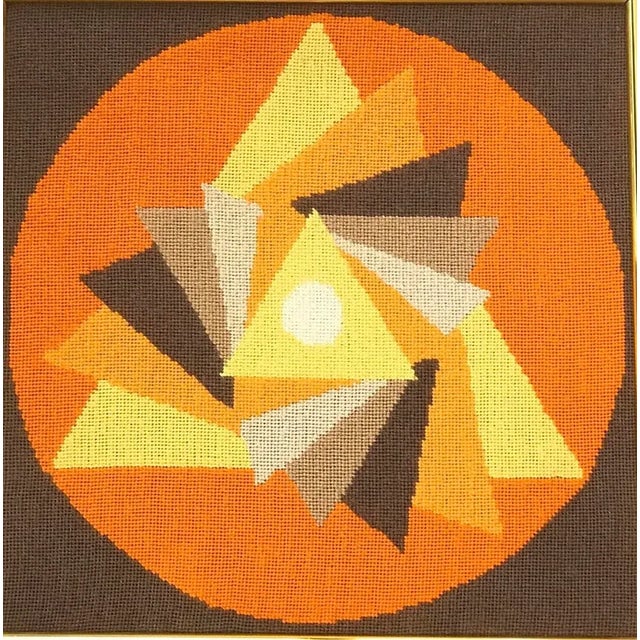 Vintage ca 1970s mid century modern Hard-edge Op Art framed needlepoint artwork. Curve of pursuit triangles pattern...