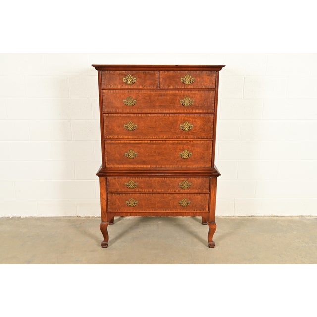 A gorgeous Georgian, Chippendale or Queen Anne style seven-drawer highboy dresser or chest of drawers By Baker Furniture,...
