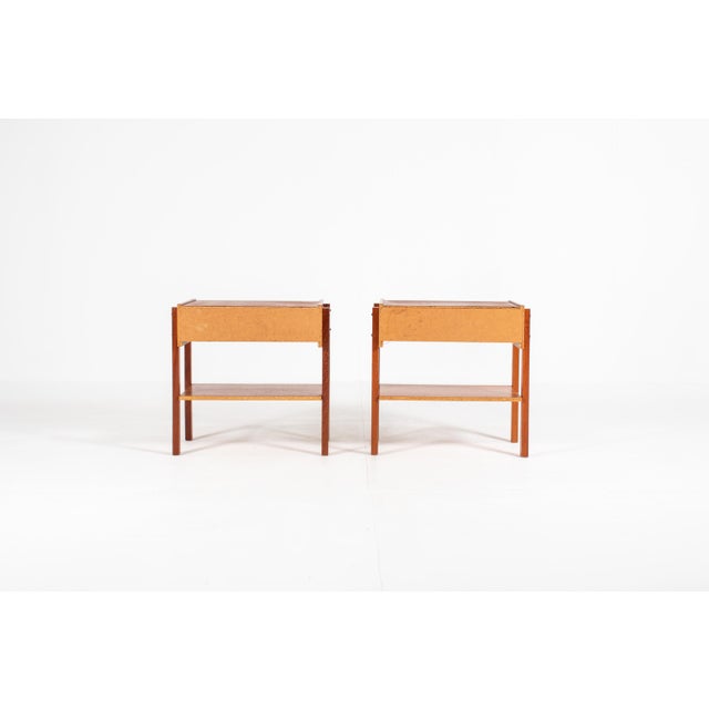A lovely matching pair of bedside tables from Denmark, 1960s. Each has one drawer with a distinctive round ring pull and...