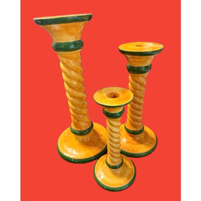 Large whimsical candleholders,crafted in Italy featuring a distinctive Tuscan design with orange/yellow and green accents....