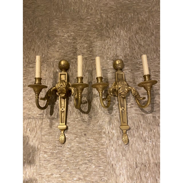 A pair of circa 1920’s gilt bronze neoclassic style sconces