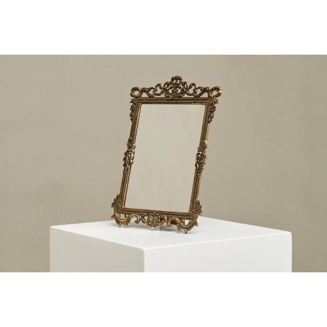 A beautiful ornate mid century Italian table mirror in silver plated brass. Very elegant and sophisticated, this table...