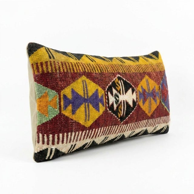 This beautiful 14'' x 35'' hand-woven Kilim pillow cover was made from an authentic Turkish kilim. The traditional flat-...