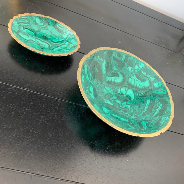 Two exquisite, decorative malachite bowls with brass rims from South Africa.