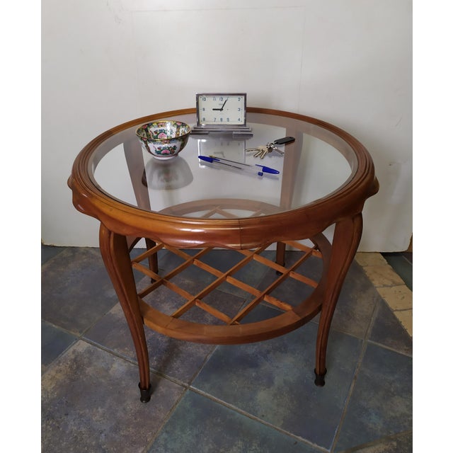 This round coffee table Is attributed to Paolo Buffa for form and style. No logo. This piece is attributed to the...