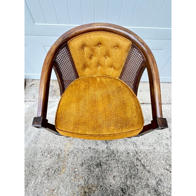 Lovely pair of vintage barrel chairs. Features cane, wood and a golden velvet fabric. Perfect to add to a living room or...