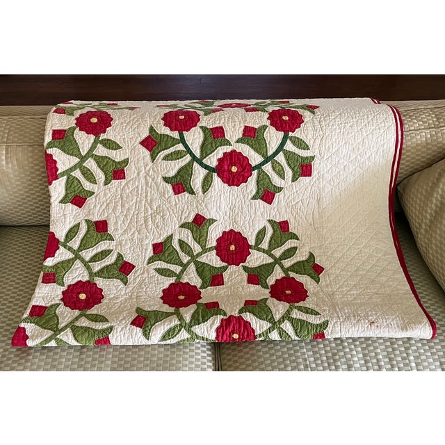 Antique late 19th / early 20th century hand sewn marriage quilt with rose wreaths. Expertly quilted in a detailed pattern....