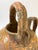 A charming antique French terracotta cruche, featuring a rounded body, short pouring spout, two arched handles and a...