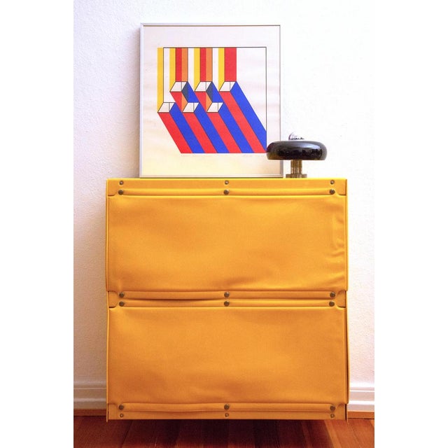 Wall cabinet / sideboard in yellow made of wood, lacquered foil/plastic and metal snap fasteners from the 'Softline'...