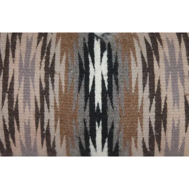 This fine handwoven weaving pillow has a taupe cotton linen backing. The insert is down and feather fill.