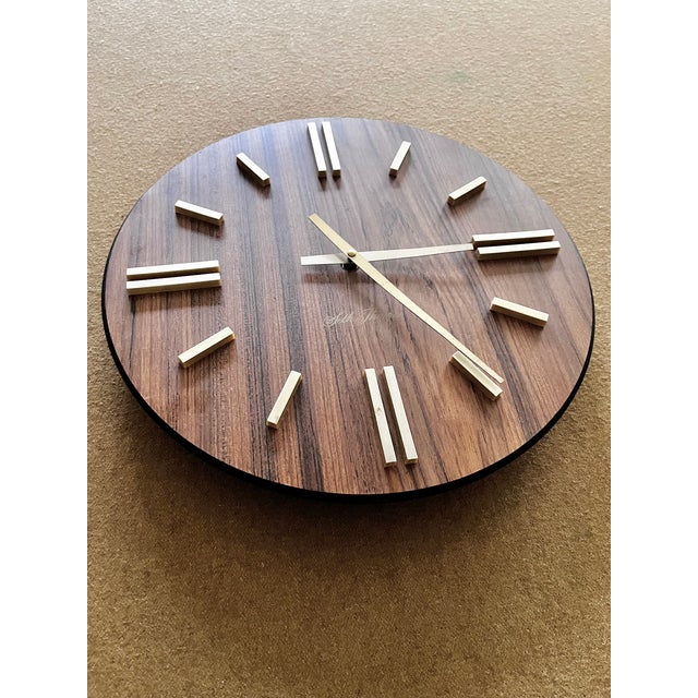 Mid-century modern “Sphere” wall clock by Seth Thomas Clock Company. A beautiful indexed clock with a walnut finish at...