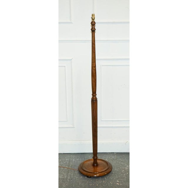 Antique 1930s Walnut Standard Floor Lamp. It is a picture of timeless elegance. The walnut wood, rich in colour and grain,...