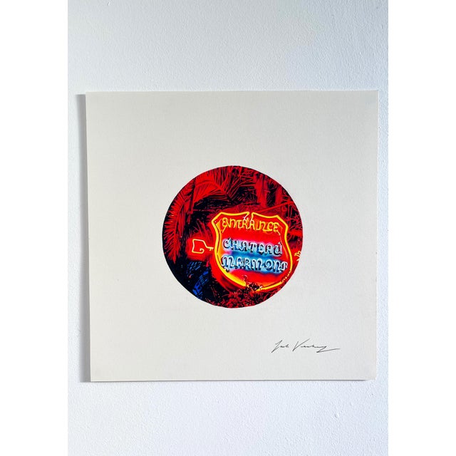 Do you check into the Chateau Marmont to be seen, or to disappear? Neon burns through the palms on Sunset, dyeing them red...