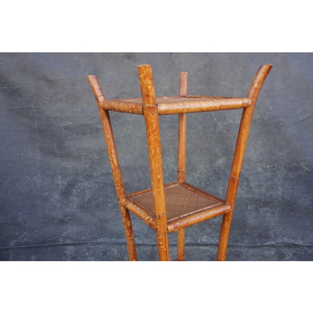 Beautiful antique bamboo and rattan 5-tier corner shelf, full of natural character and timeless charm. The bamboo displays...