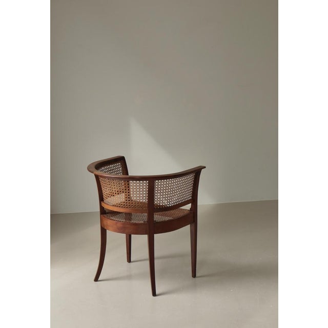 Very rare and early Kaare Klint "Faaborg" armchair in Cuban mahogany, oak and cane. Made at Cabinetmakers Rud Rasmussen,...