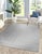 A hand-knotted wool rug, made in India and measuring 4' x 6'. Geometric drawing - repeating motifs held inside strong...