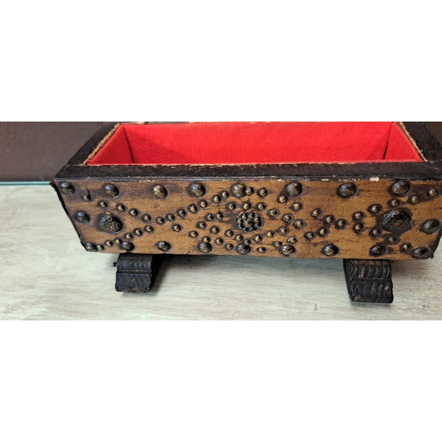Antique wooden and leather chest with studs, highly decorative in a rustic Castilian style and in excellent condition....