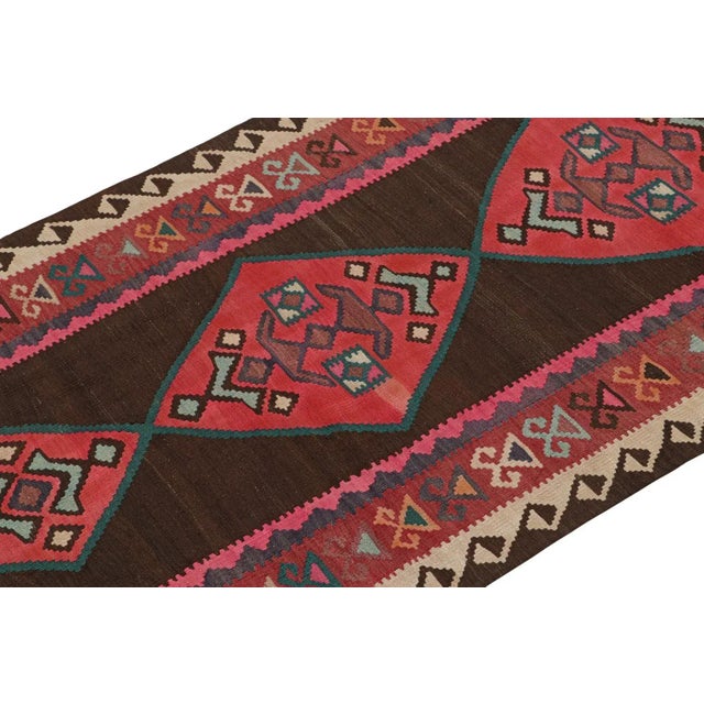 This vintage 4x9 Persian Kilim is a tribal rug from Meshkin—a small northwestern village known for its fabulous works....