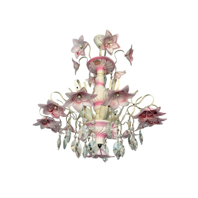 A sculptural vintage Murano style glass chandelier featuring delicate hand-blown floral elements in soft pink tones,...