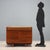 Solid wood centerpiece with glass top, drawers, and a rolling shutter, crafted with walnut veneer. In very good condition,...
