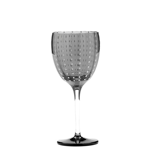 Collection for the table in clear colored glass. It includes tumblers for water and soft drinks, wine glasses, flute...