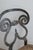 A striking blend of sculptural form and artisanal craftsmanship, this Biedermeier-style forged iron dining or side chair...