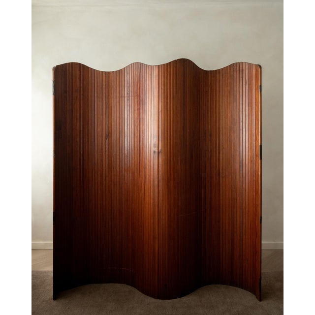 A vintage french art deco pine tambour room divider attributed to jomain baumann for baumann, produced in france during...