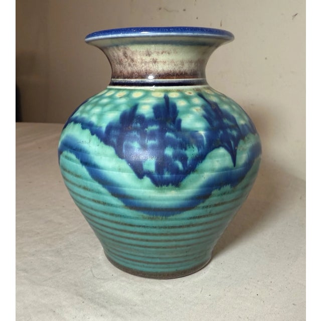 The Original John Preschutti, Graeagle Oktoberfest blue glazed pottery vase is a handmade art pottery piece from 1997....