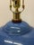 Classic blue table lamp by Ralph Lauren. Slight crackle finish beneath the glaze gives a luminous quality. Wood base with...
