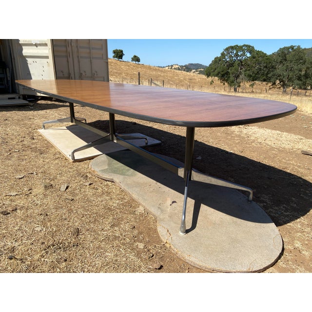 The Vintage Herman Miller Aluminum Group conference table is a rare find from the 1960s, featuring an oval shape and a...