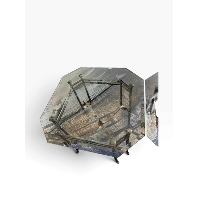 A distinctive pair of Hollywood Regency Labarge style side tables combining substantial iron frames with thick octagonal...