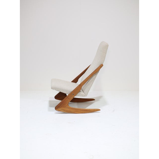 Rare 'boomerang' rocking chair, manufactured by mogens kold in denmark during the 1950s or 1960s. This beautiful lounge...