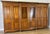 A magnificent Vintage 6 Door Ehalt wardrobe, beautifully crafted with elegant panelled doors, warm rich finish, and...