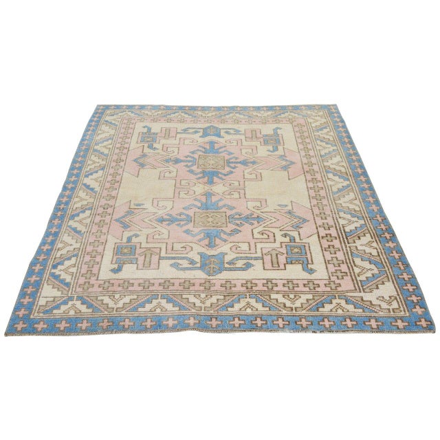 Hand-knotted with care using traditional rug-making techniques, this wool rug blends timeless craftsmanship with a modern...